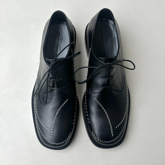 Sashiko Derby (2026) .Lace Up Closure. Signature Curve Motif Sashiko Stitches. Cow Leather Sole. Heel Height: 3 Cm. Leather From Germany.